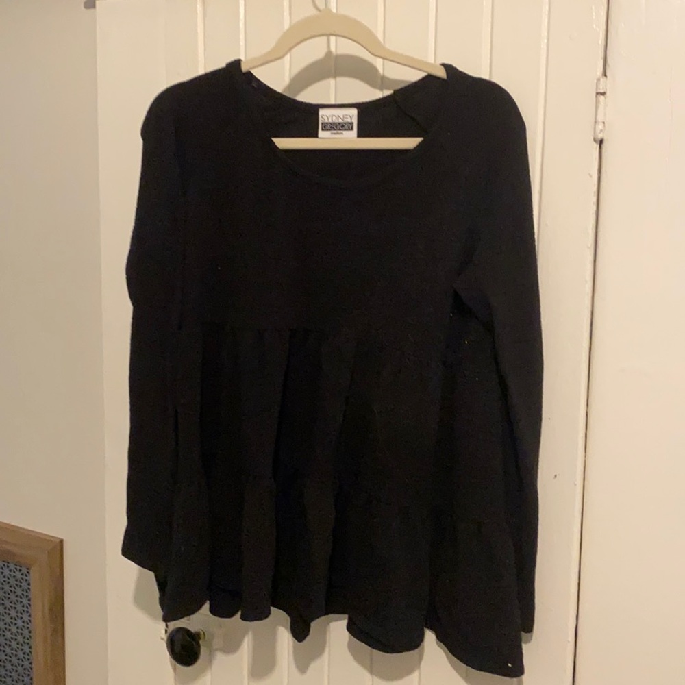 Women’s baby doll style long sleeve shirt.